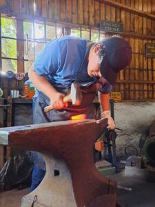 Man forging a knife