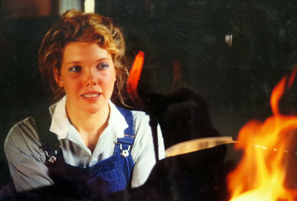 A photo of a young Heather forging